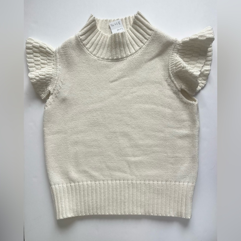 Cream knit crop blouse with flair sleeves.